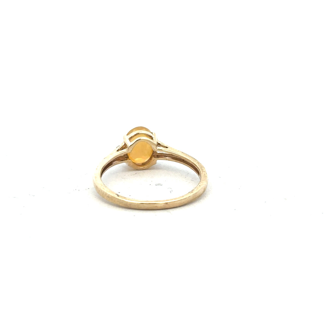 9ct yellow gold diamond ring in size T1/2 featuring a sparkling diamond, displayed on a plain background.