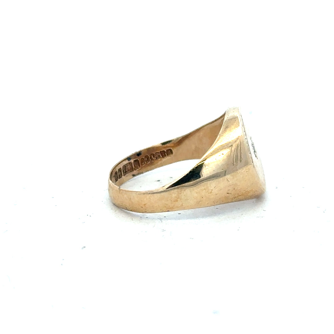 9ct yellow gold diamond signet ring in size U, featuring a polished surface and a central diamond accent.