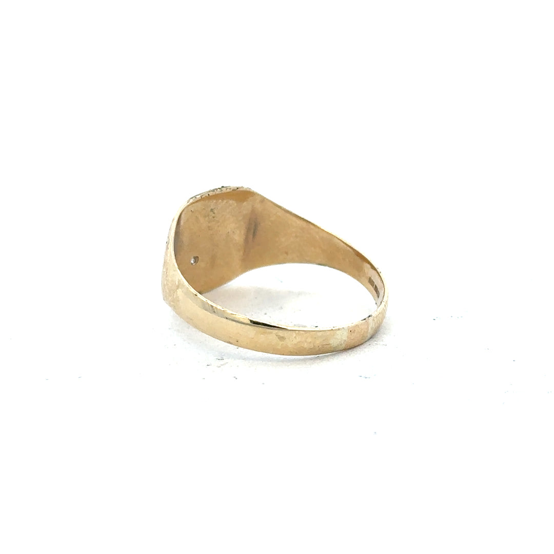 9ct yellow gold diamond signet ring in size Y with a polished surface and detailed engraved design.
