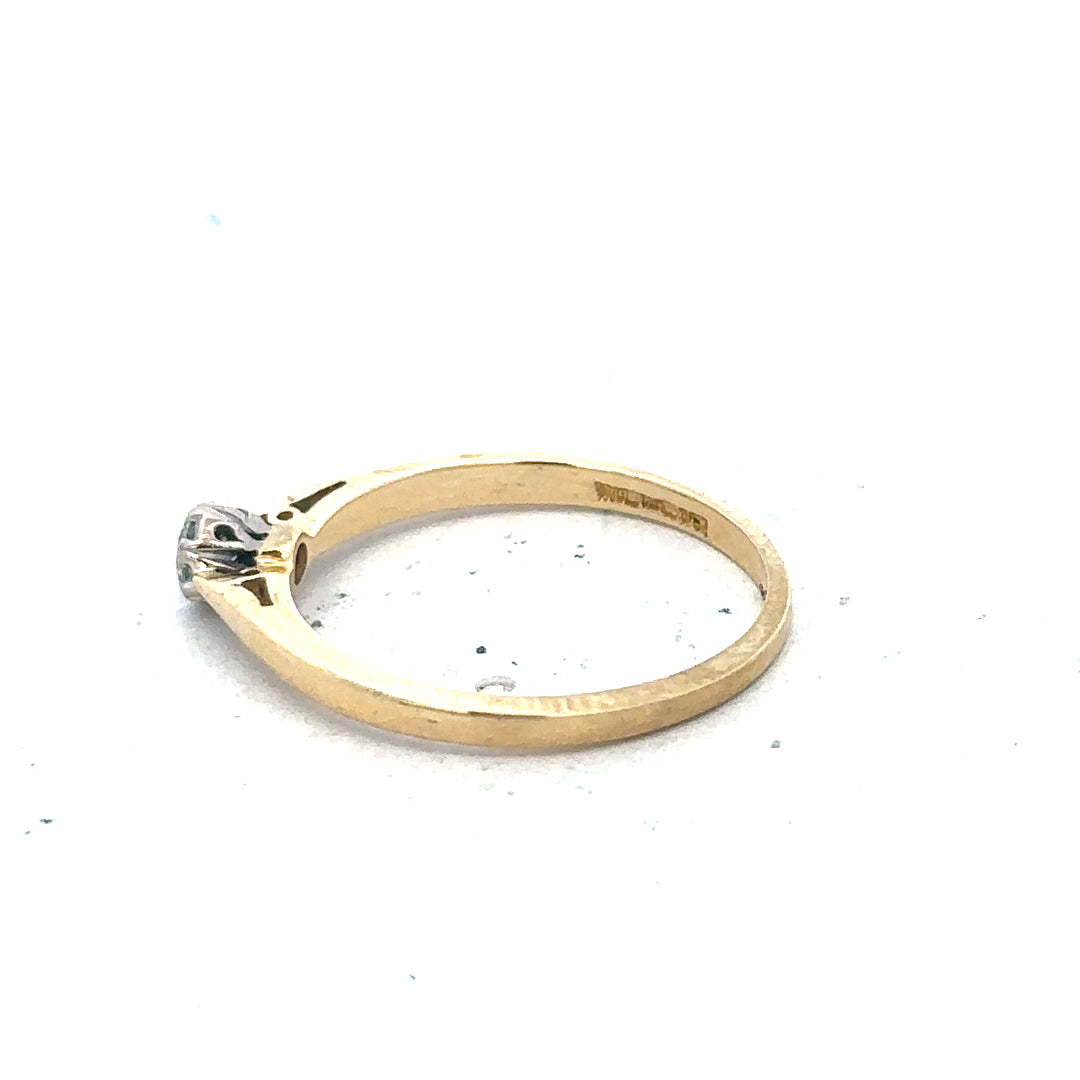 9ct yellow gold diamond solitaire ring featuring a central sparkling diamond and a smooth gold band.
