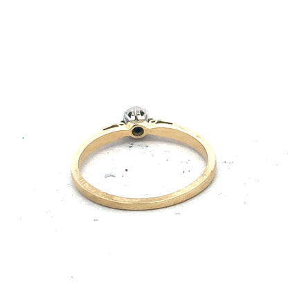 9ct yellow gold diamond solitaire ring with a prominent central gemstone and a sleek band design.