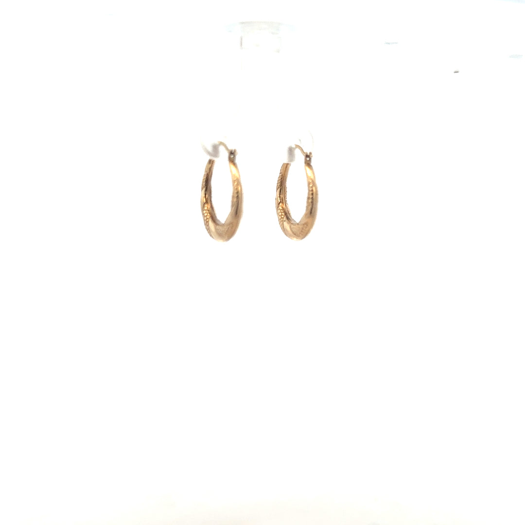 Pair of 9ct yellow gold earrings weighing 0.8g, featuring a simple and elegant design, unbranded jewelry for everyday wear.
