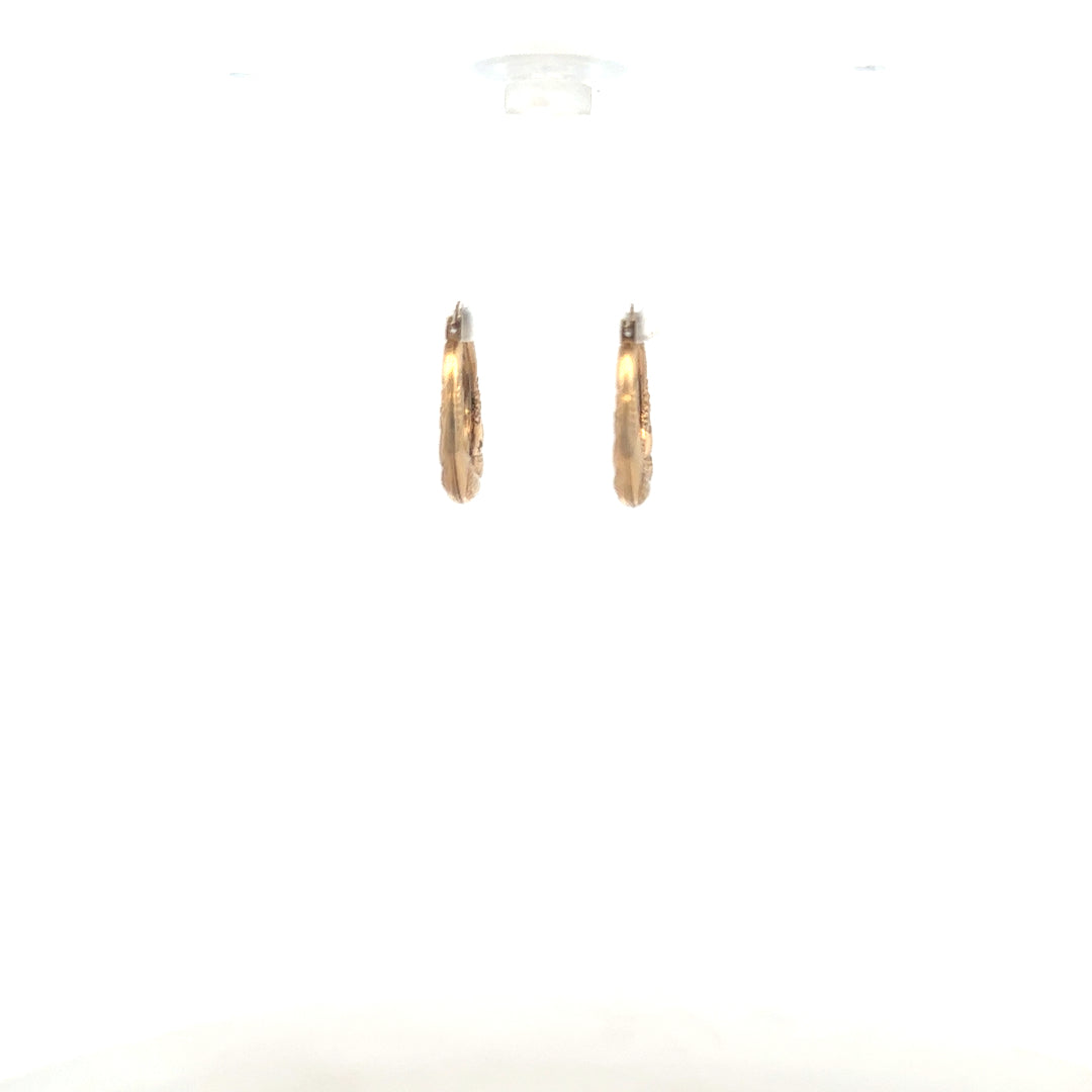 9ct yellow gold earrings with a delicate design, weighing 0.8g, showcased on a plain background.