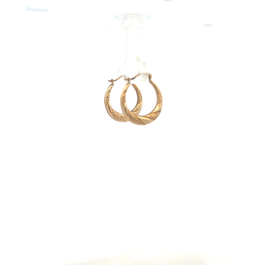 9ct yellow gold earrings weighing 0.8g, featuring a classic design, displayed in a natural pose.