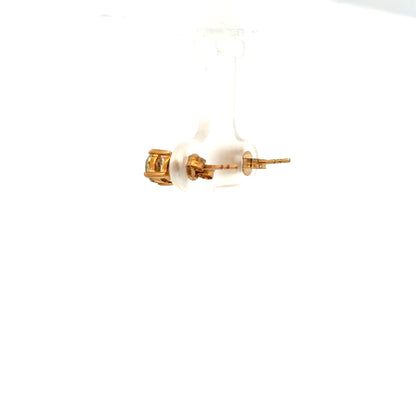 9ct yellow gold earrings weighing 1.2g, featuring a simple elegant design, photographed on a plain background.