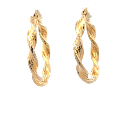 9ct yellow gold earrings weighing 1.6g, featuring a simple and elegant design, displayed on a plain background.