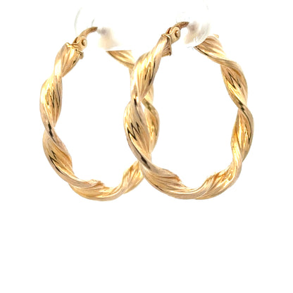 9ct yellow gold earrings weighing 1.6g, unbranded, featuring a classic design with polished finish, displayed against a neutral background.
