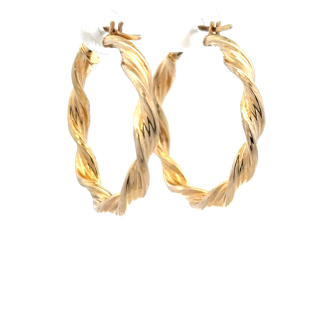 9ct yellow gold earrings weighing 1.6g, featuring a simple and elegant design, shown on a neutral background.