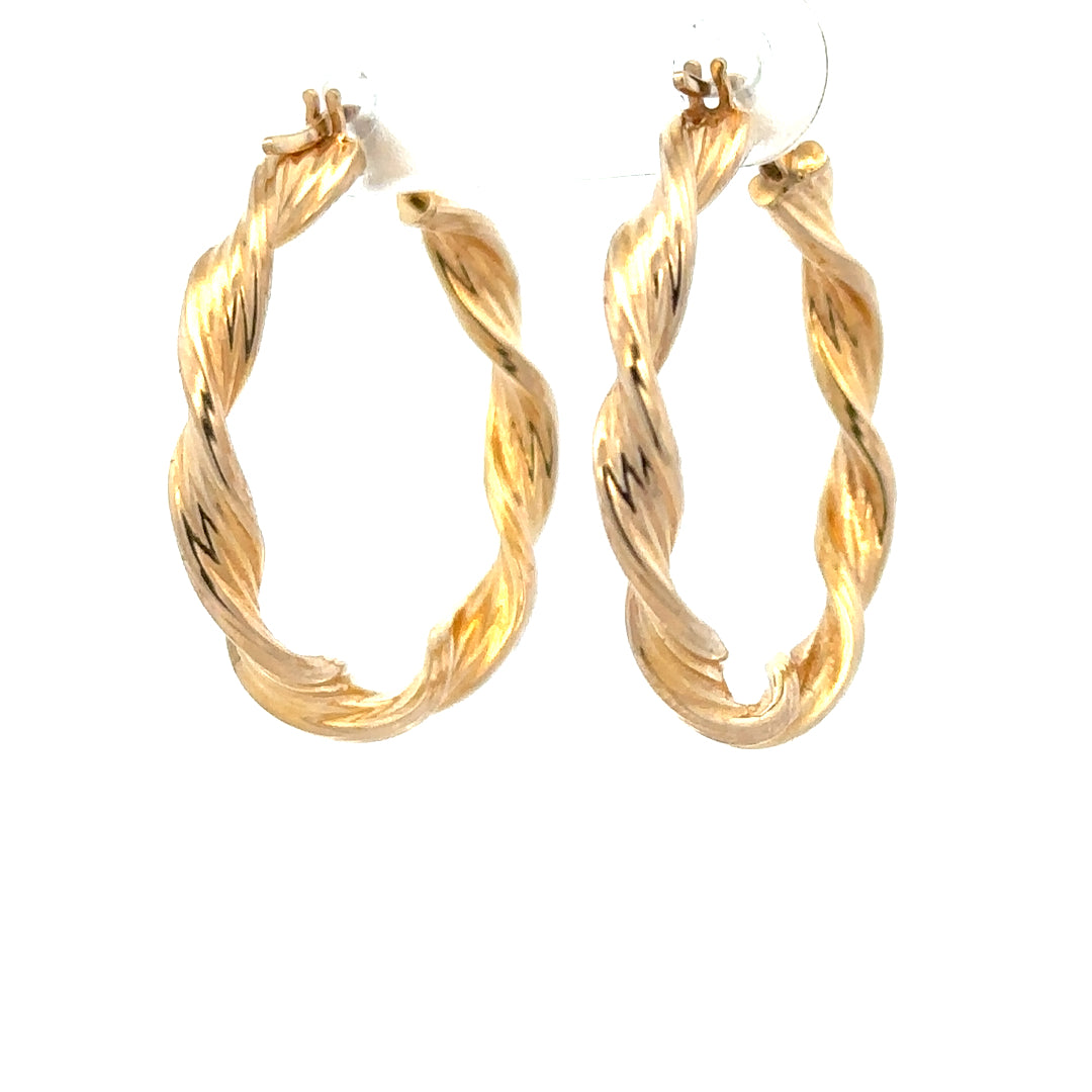 9ct yellow gold earrings weighing 1.6g, featuring a simple elegant design, showcased against a neutral background.