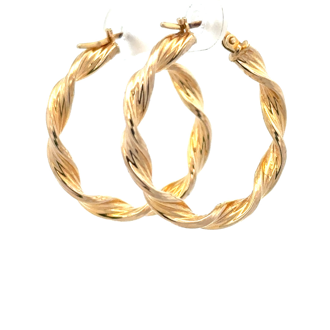 9ct yellow gold earrings with a delicate design, weighing 1.6g, showcasing elegant jewelry craftsmanship.