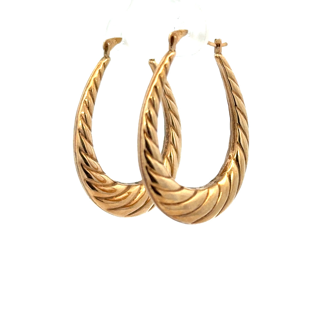 9ct yellow gold earrings weighing 1.6g, unbranded, with a classic design, shown in a close-up image.