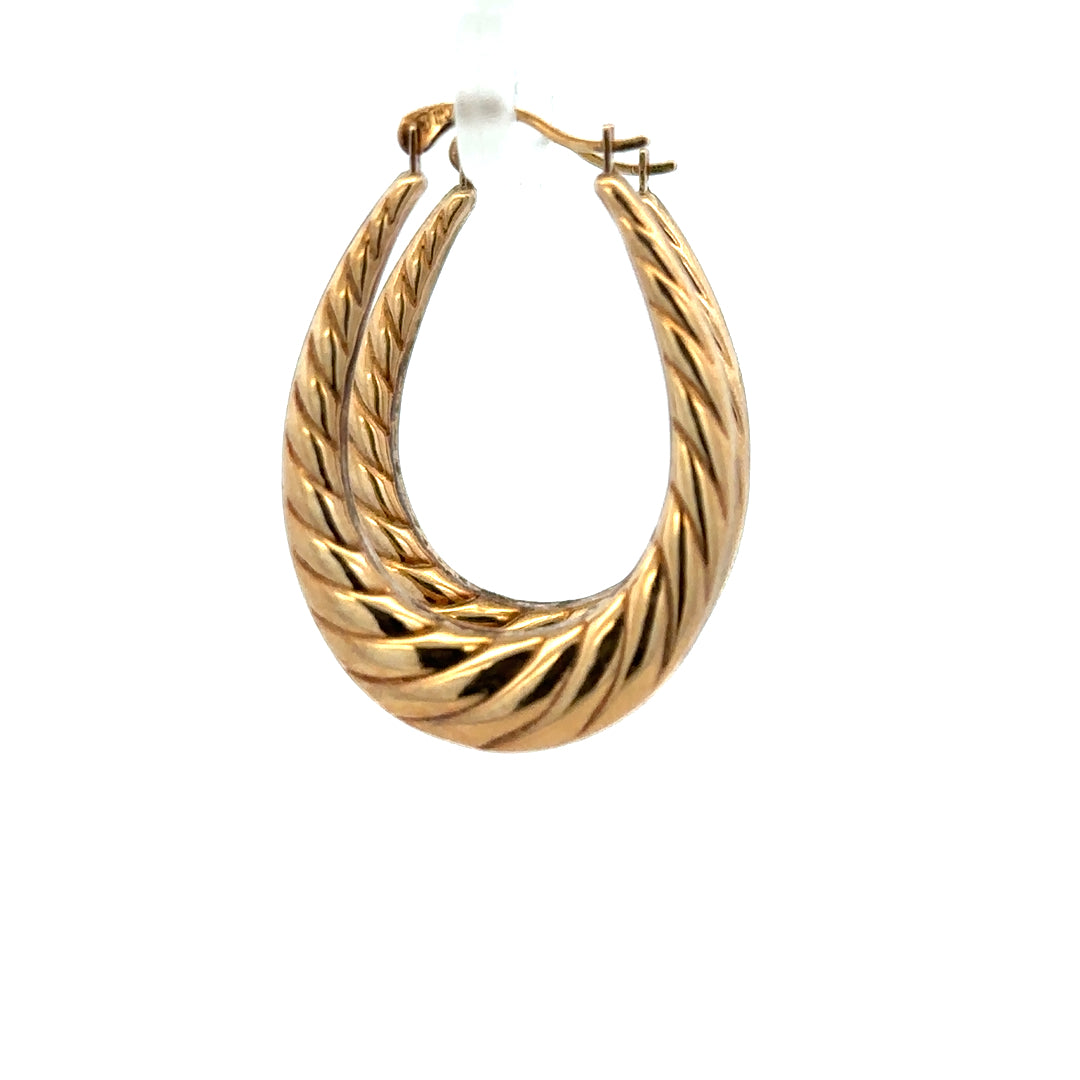 9ct yellow gold earrings weighing 1.6g, unbranded, with a classic design, shown in a close-up view.