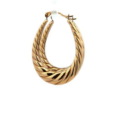 9ct yellow gold earrings weighing 1.6g, unbranded, with a classic design, shown in a close-up view.