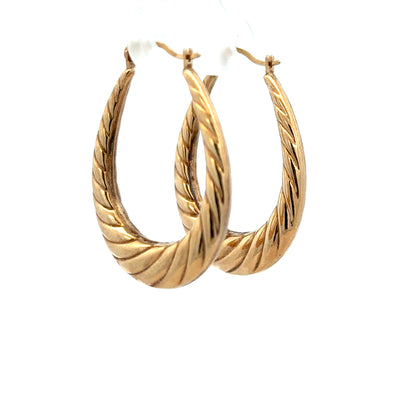 9ct yellow gold earrings, unbranded, lightweight 1.6g, stylish jewelry with a classic design displayed on a plain background.