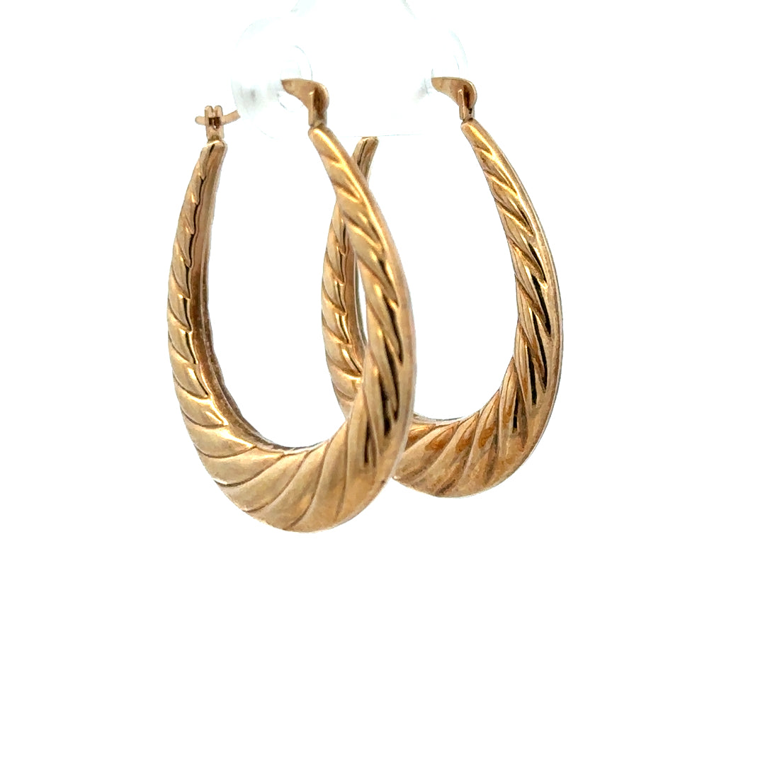 9ct yellow gold earrings weighing 1.6g, featuring a classic design, showcased in a close-up shot highlighting their polished finish.