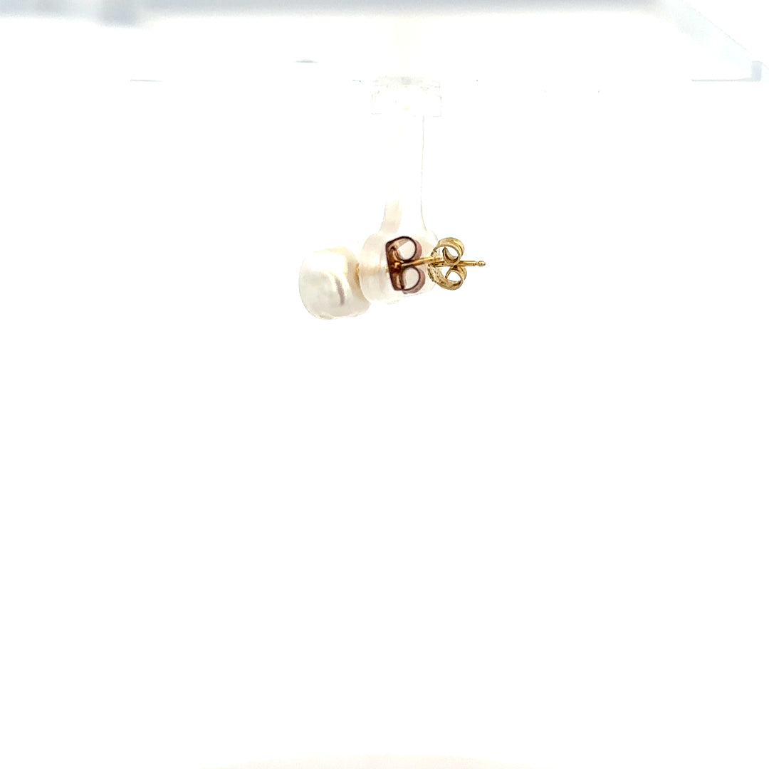 9ct yellow gold earrings weighing 2.6g, displayed with a classic design, showcasing their elegant craftsmanship.