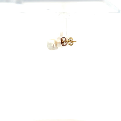 9ct yellow gold earrings weighing 2.6g, displayed with a classic design, showcasing their elegant craftsmanship.