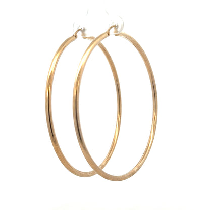 9ct yellow gold earrings weighing 3.4g, featuring a classic design, shown in a close-up view.
