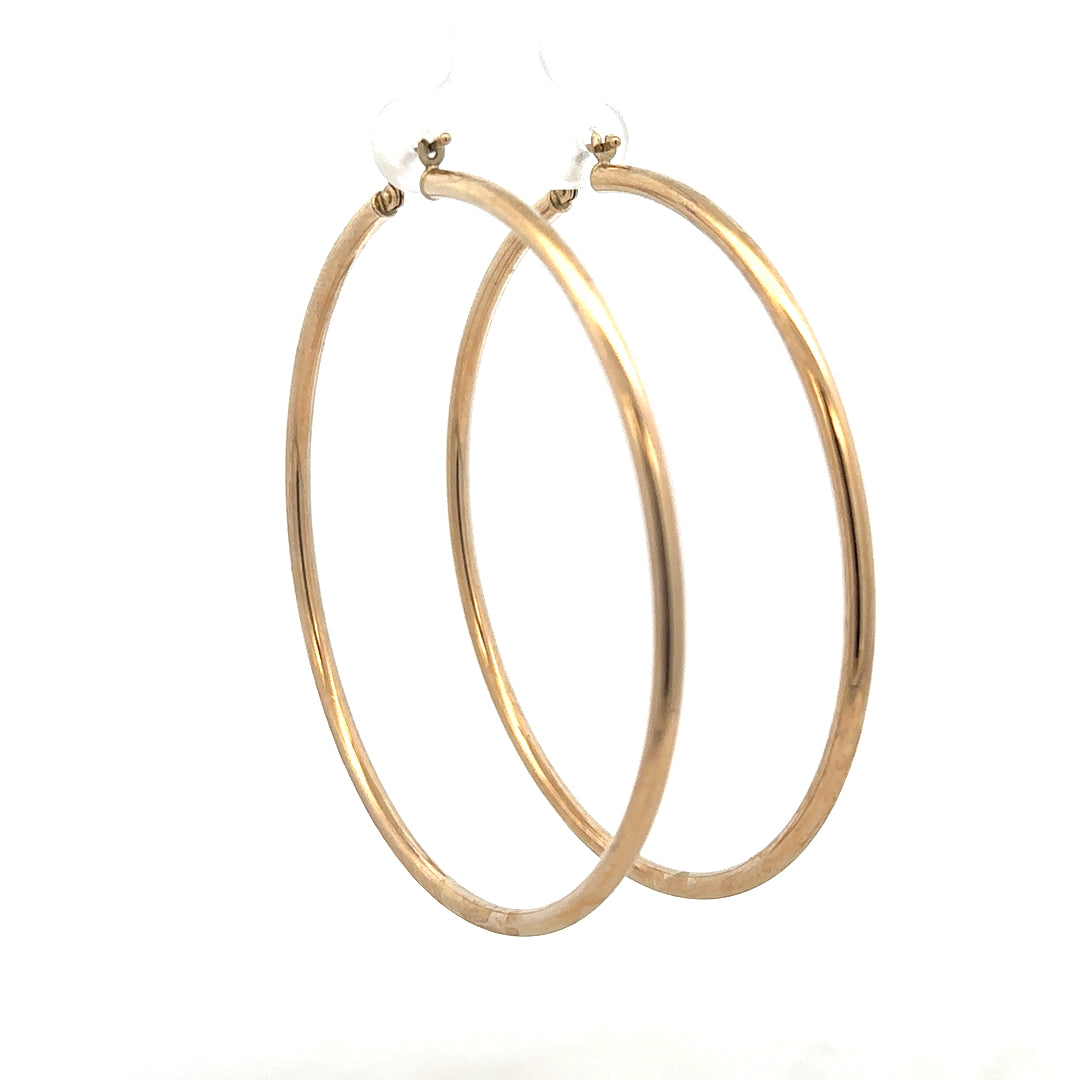 9ct yellow gold earrings weighing 3.4g, featuring a classic design and polished finish, displayed on a neutral background.