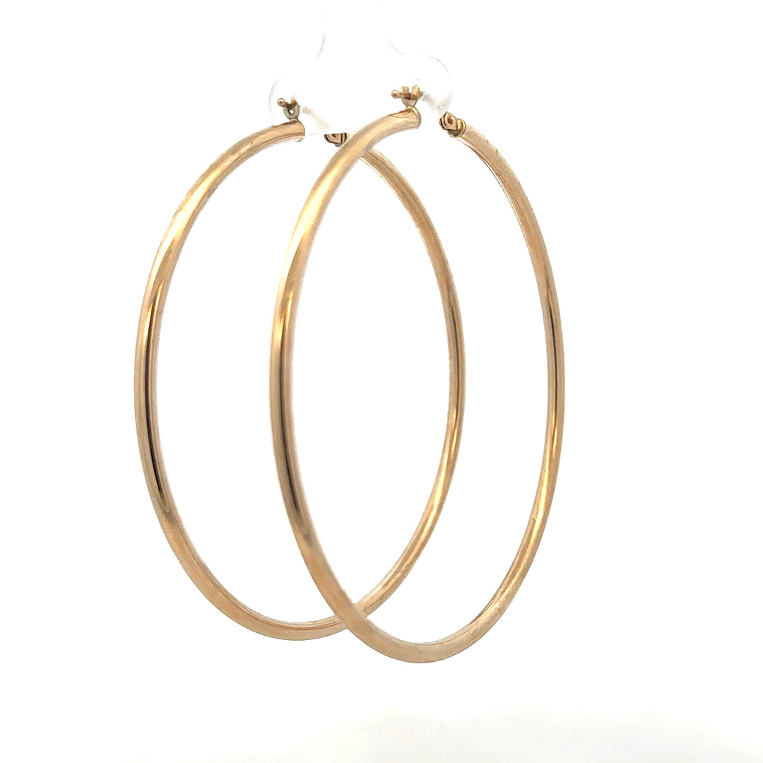 9ct yellow gold earrings weighing 3.4g, featuring a classic design, shown in a close-up image with a simple background.