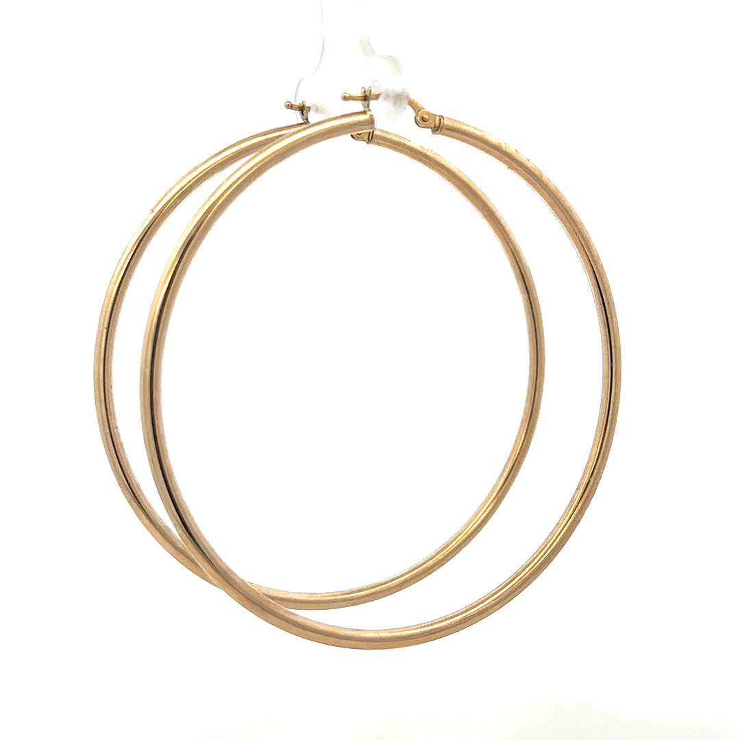 9ct yellow gold earrings weighing 3.4g, featuring a classic design, displayed against a neutral background.