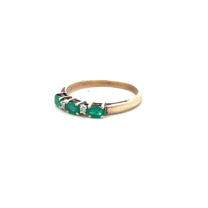 9ct yellow gold emerald and diamond ring in size T, featuring a central emerald and sparkling diamonds on an unbranded band.