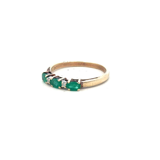 9ct yellow gold emerald and diamond ring in size T, featuring a central emerald and sparkling diamonds on an unbranded band.