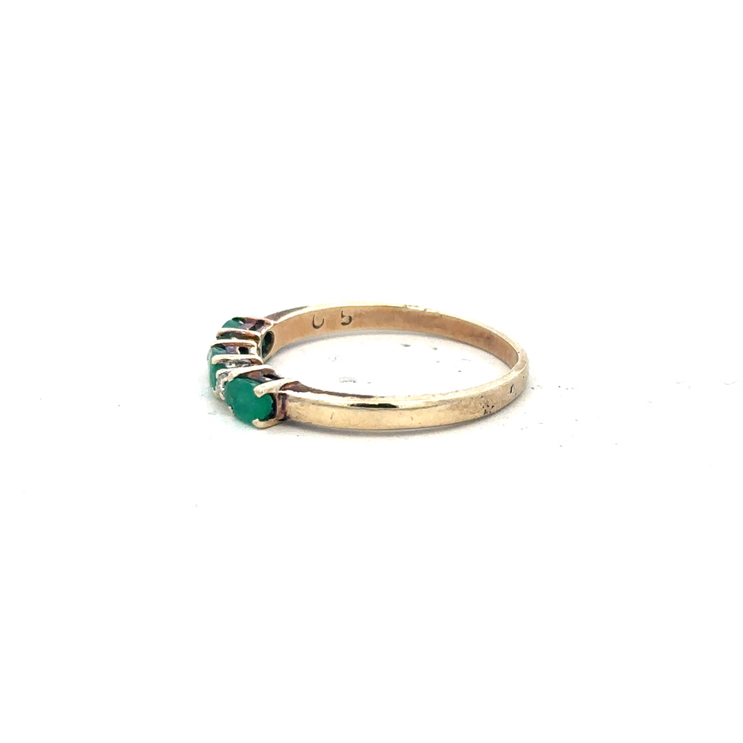 9ct yellow gold emerald and diamond ring in size T, featuring a central emerald with diamond accents, unbranded jewelry.