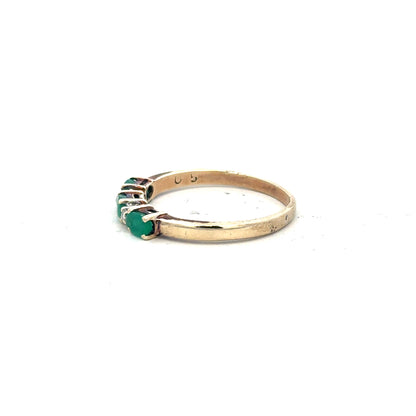 9ct yellow gold emerald and diamond ring in size T, featuring a central emerald with diamond accents, unbranded jewelry.
