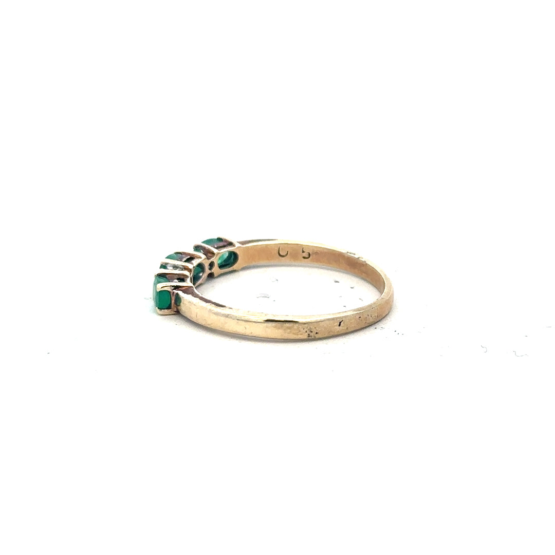 9ct yellow gold emerald and diamond ring, size T, featuring a central emerald with surrounding diamonds, unbranded jewelry.