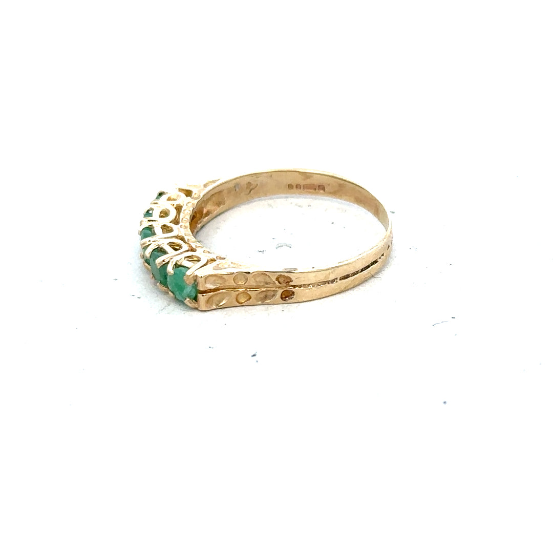9ct yellow gold emerald ring in size P with a central emerald gemstone, showcasing a classic and elegant jewelry design.