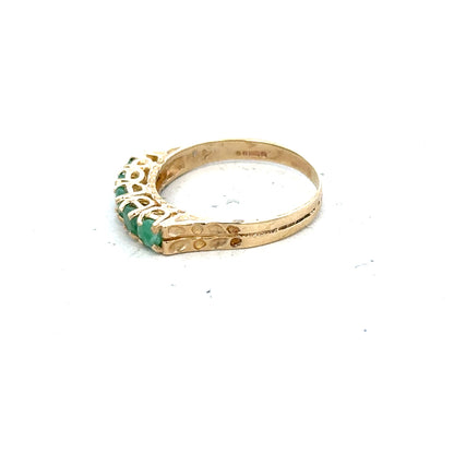 9ct yellow gold emerald ring in size P with a central emerald gemstone, showcasing a classic and elegant jewelry design.