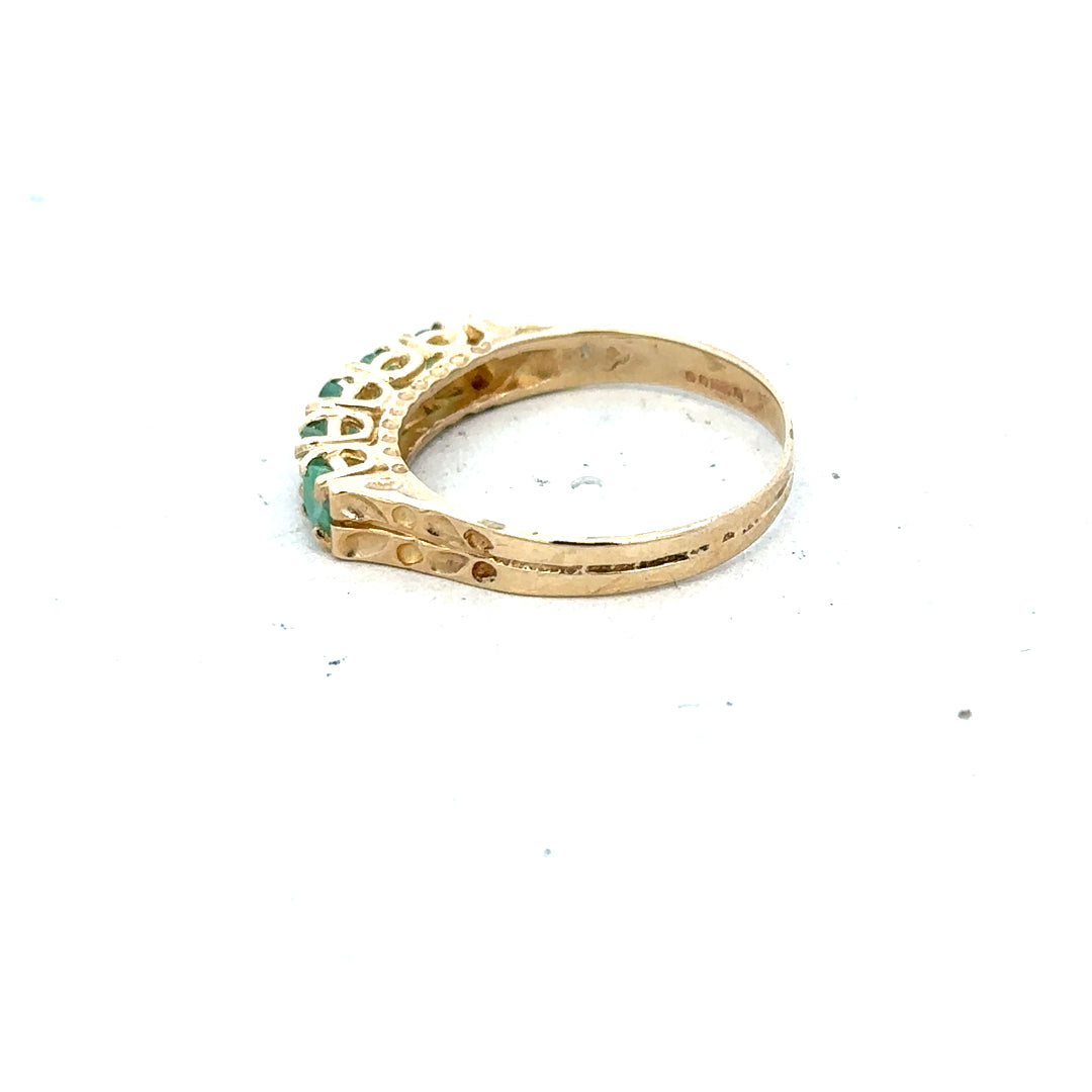 Yellow gold emerald ring in size P featuring a vibrant emerald gemstone, crafted in 9ct yellow gold.