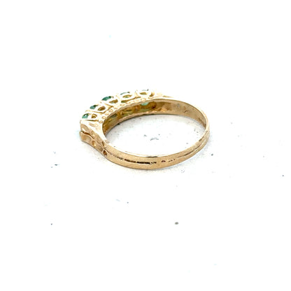9ct yellow gold emerald ring in size P with a central emerald gemstone, unbranded jewelry showing detailed design.