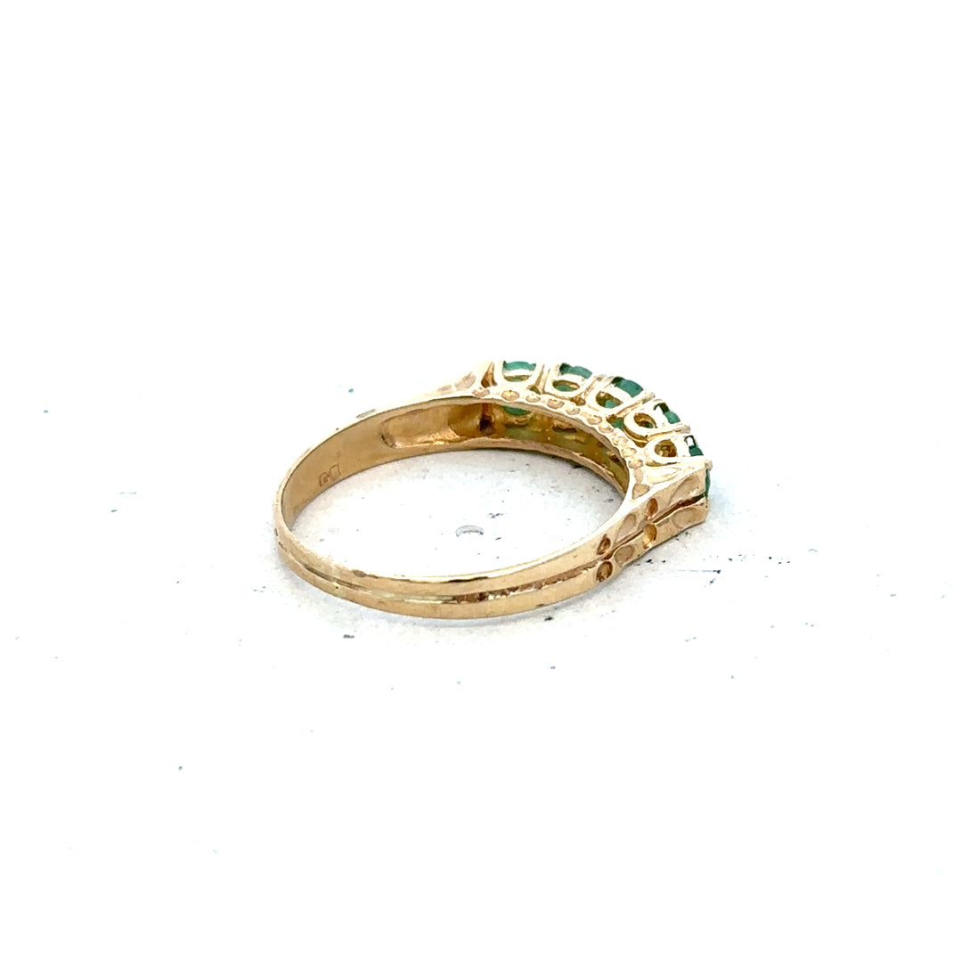9ct yellow gold emerald ring in size P with a central emerald gemstone, featuring a simple elegant design.