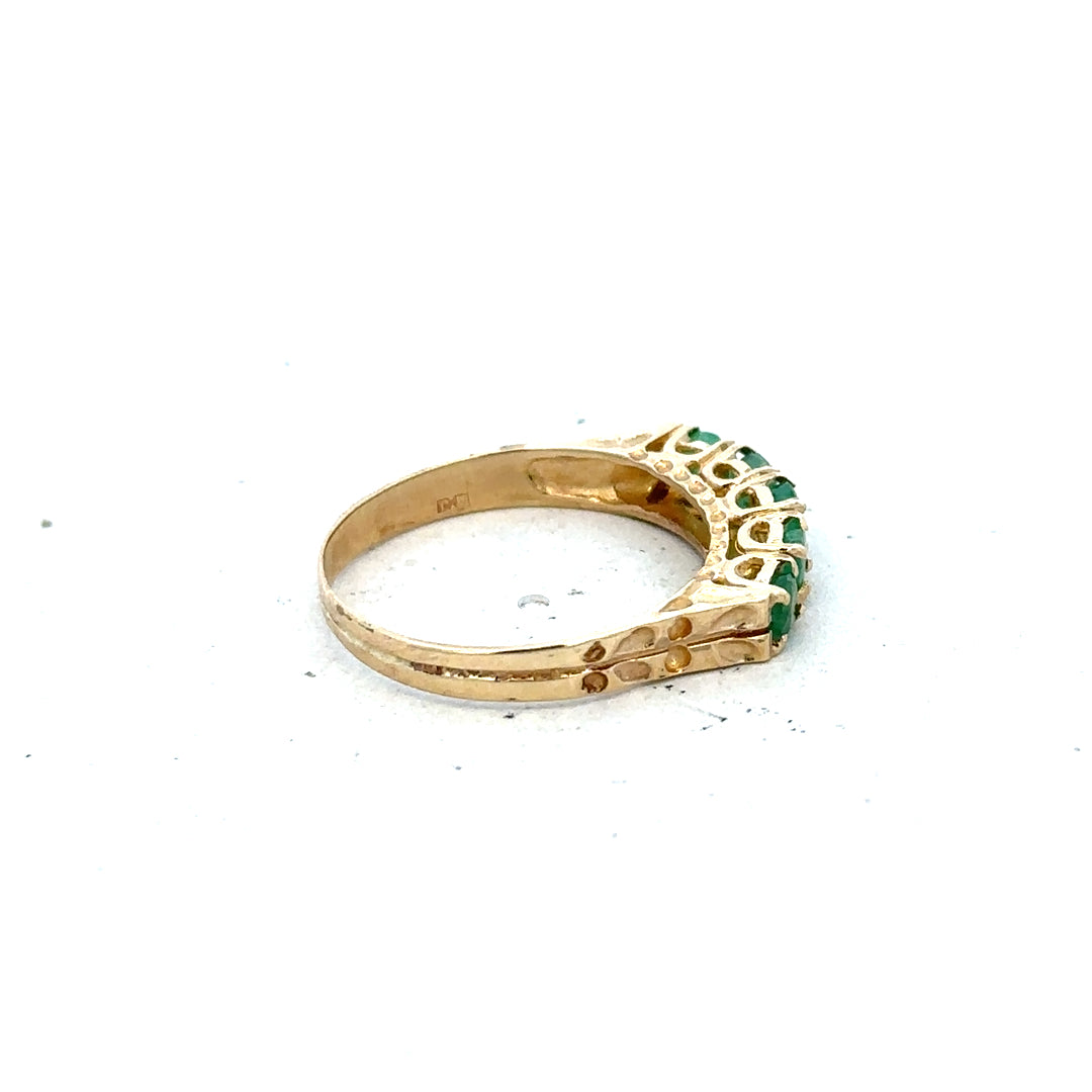 9ct yellow gold emerald ring in size P with a central emerald gemstone, unbranded jewelry piece.