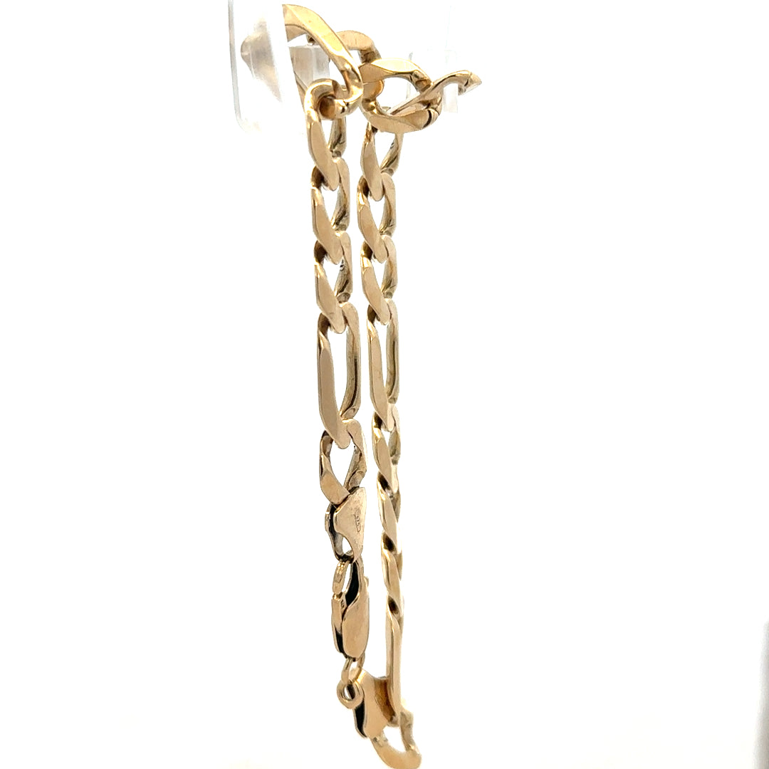 9ct yellow gold figaro bracelet, unbranded, featuring a classic chain design, weighing 20.1 grams, displayed on a neutral background.