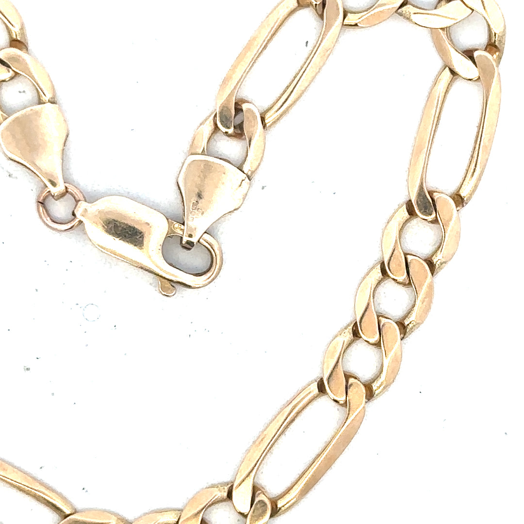 9ct yellow gold figaro bracelet weighing 9g, unbranded, with interlinked chain design visible in the image.