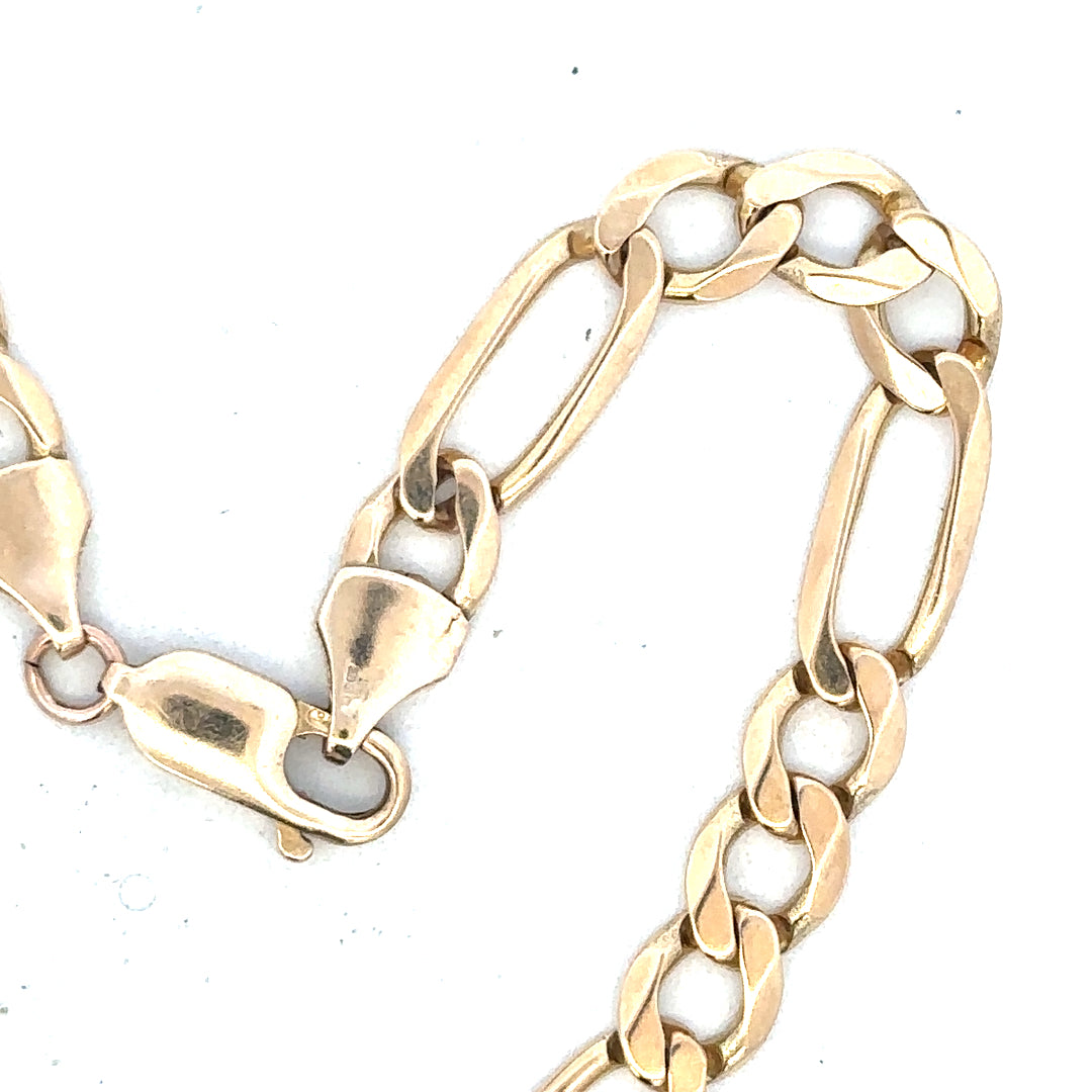 9ct yellow gold Figaro bracelet weighing 9g, unbranded, with a distinctive chain link design, shown in a detailed product image.