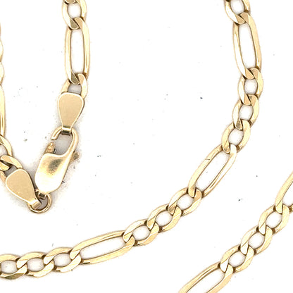 9ct yellow gold Figaro chain with 11g weight, showcasing its intricate links and shiny finish.