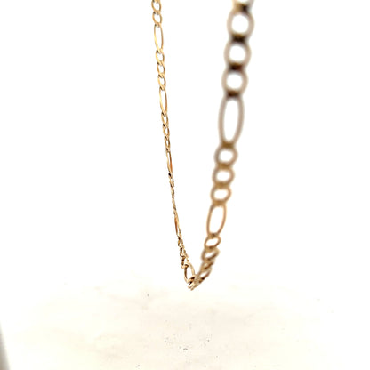 9ct yellow gold figaro chain weighing 12.7g, unbranded jewelry piece with intricate link design, shown in close-up image.