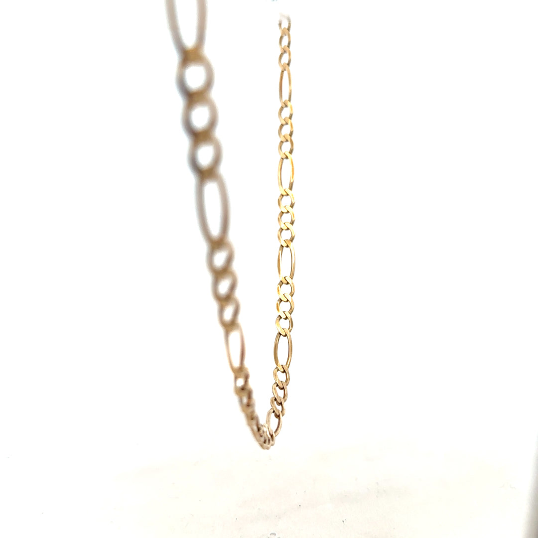 9ct yellow gold figaro chain weighing 12.7g, showcasing its polished links and elegant design.
