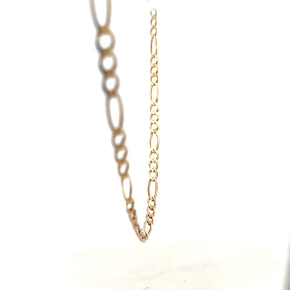 9ct yellow gold figaro chain weighing 12.7g, showcasing its polished links and elegant design.