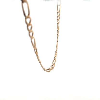 9ct yellow gold figaro chain weighing 25.9g, unbranded jewelry with intricate linked design, shiny and polished finish.