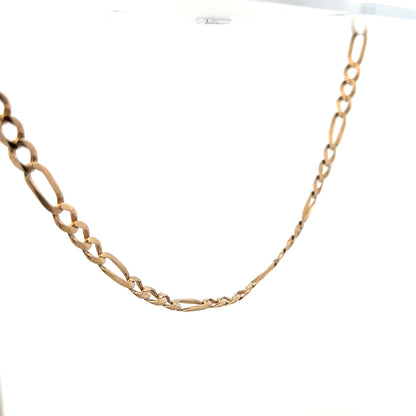 9ct yellow gold figaro chain weighing 25.9g, featuring interlinked oval and circular links, unbranded jewelry accessory.