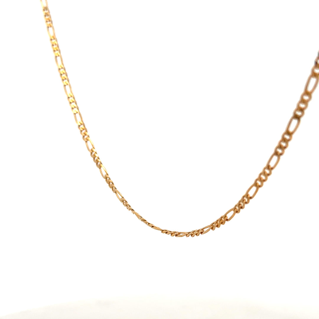 9ct yellow gold Figaro chain weighing 3.7g, unbranded jewelry with intricate link design, close-up of chain details.