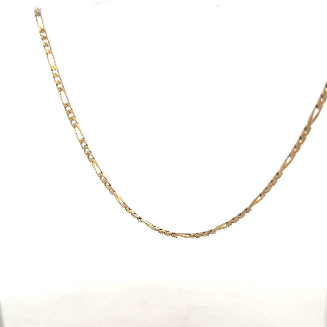 9ct yellow gold figaro chain weighing 7.2g, unbranded jewelry with intricate linked design, displayed against a neutral background.