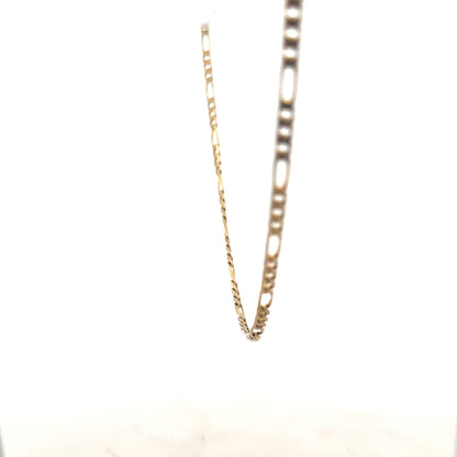9ct yellow gold Figaro chain, unbranded, showcasing its polished links and elegant design, weighing 7.2 grams.