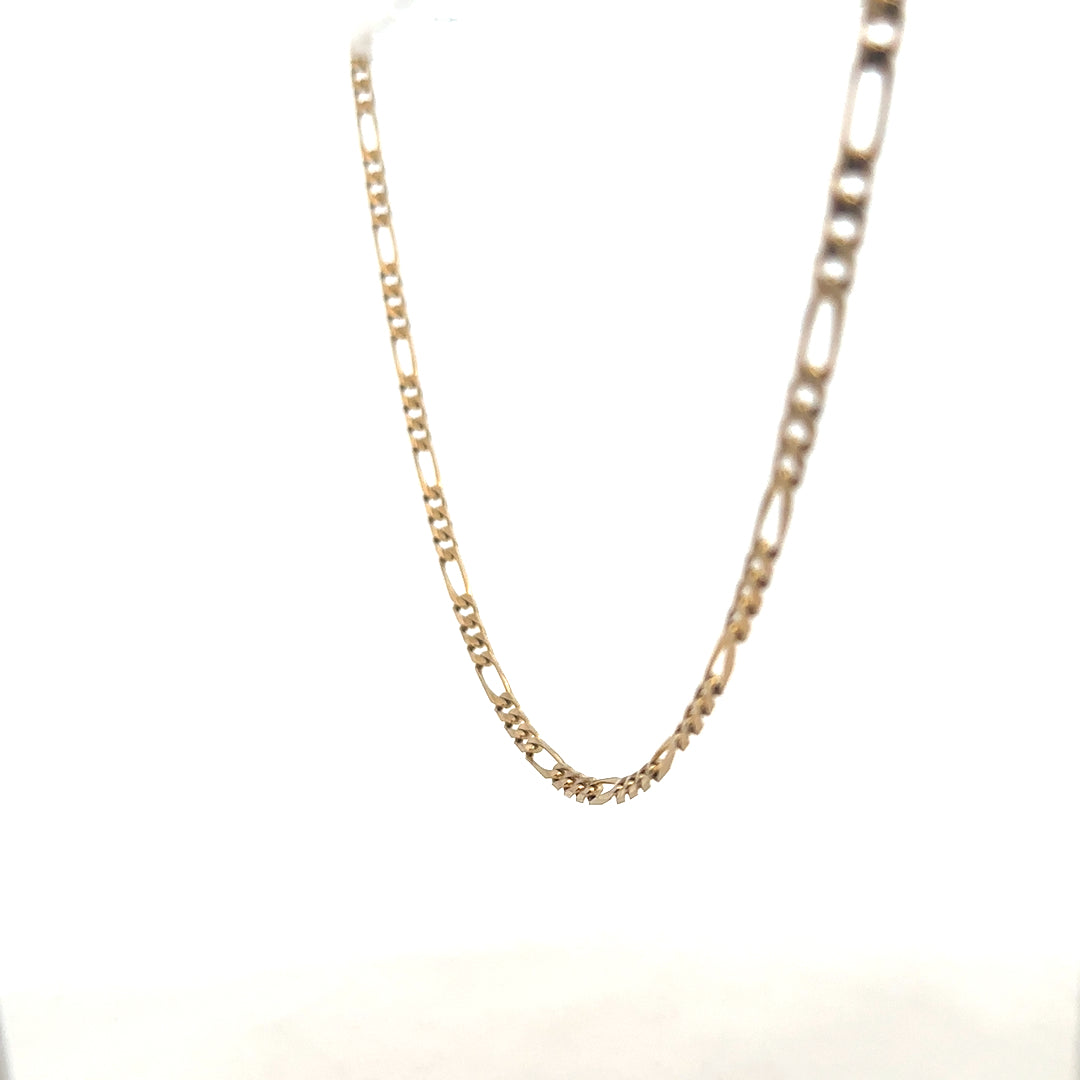 9ct yellow gold Figaro chain weighing 7.2g, unbranded jewelry with intricate linked design.