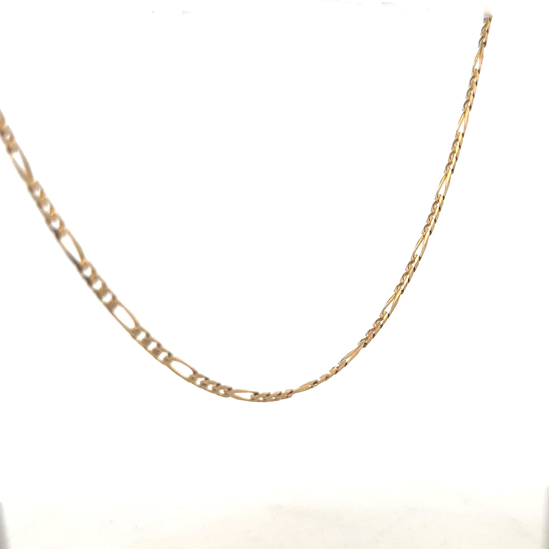 9ct yellow gold Figaro chain weighing 7.2g, unbranded jewelry with intricate links and polished finish.